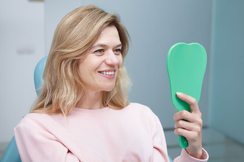 full mouth dental implants patient smiling after procedure