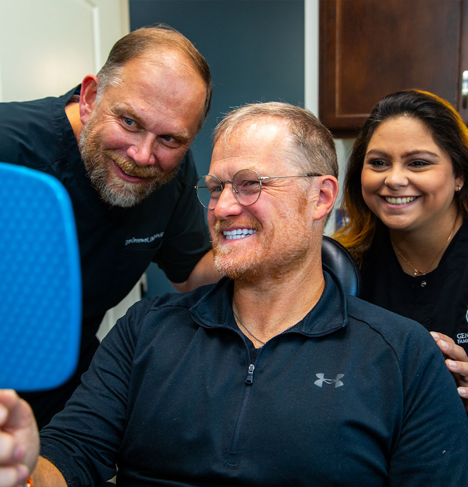 patient smiling confidently after their dental treatment