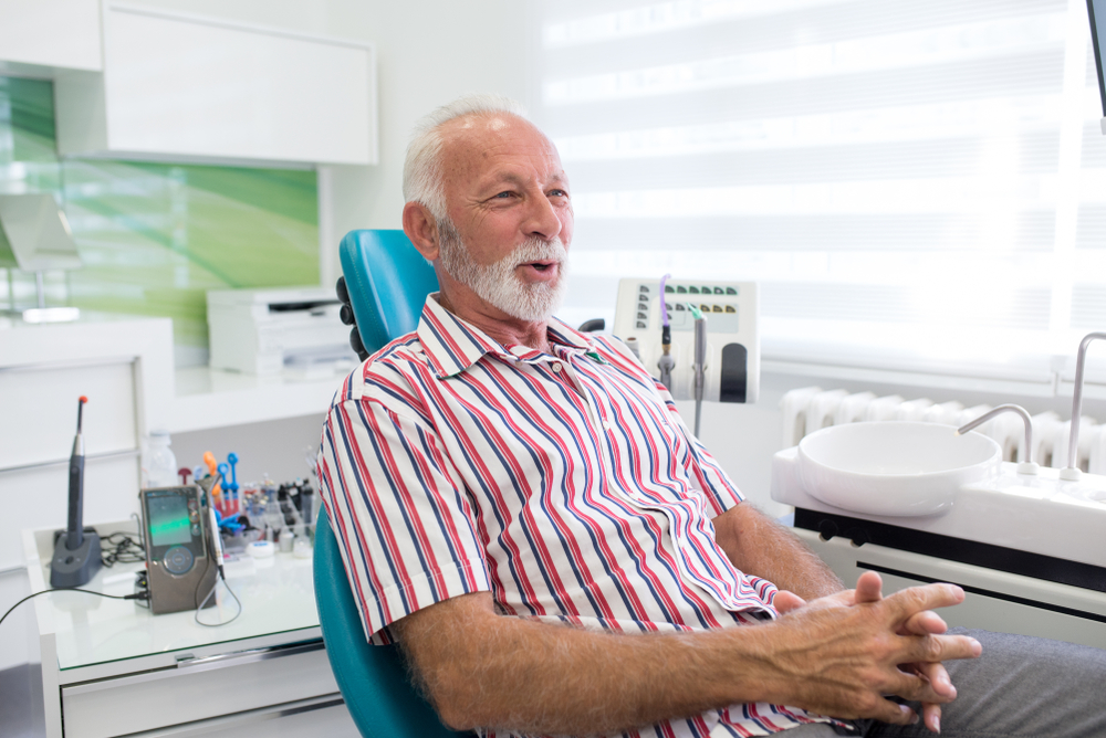 Family consultation at dental clinic discussing implants